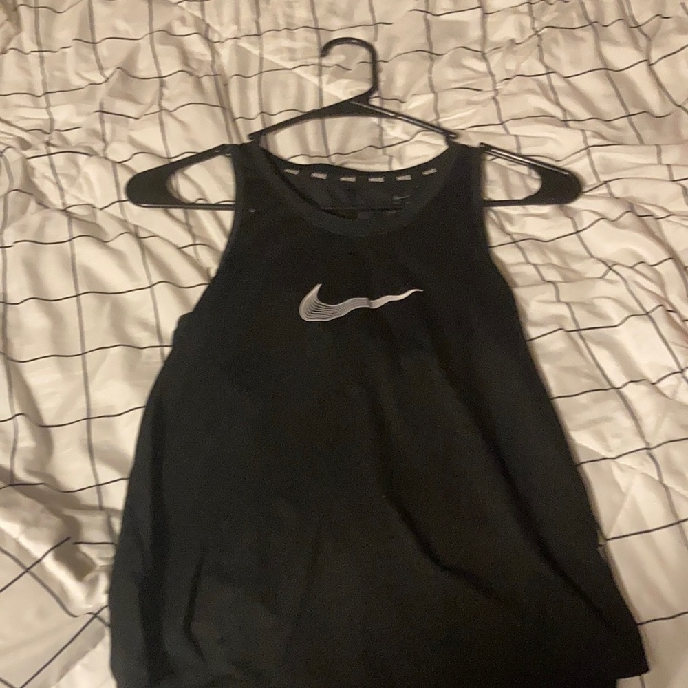 I am selling a cute Nike  black tank top because I don’t like it anymore